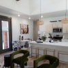 Living room with seating and a kitchen island 